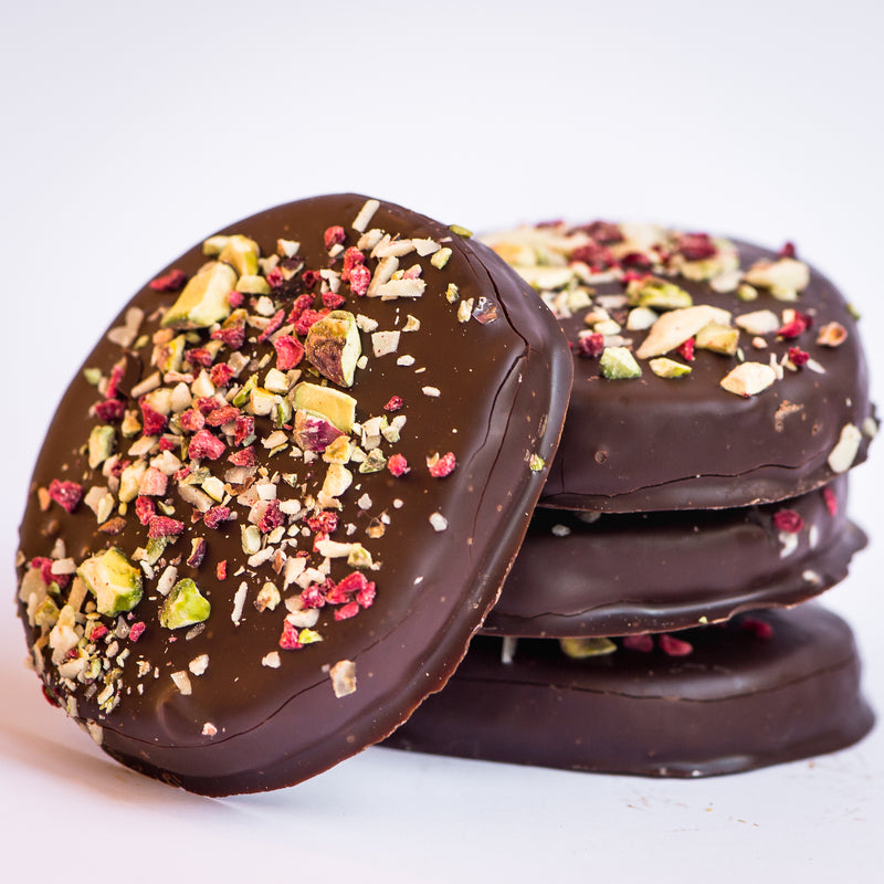 Gumnut Biscuits Raspberry Dark Chocolate Shortbread, a shortbread with pistachios, almonds and a hint of lemon coated with dark chocolate